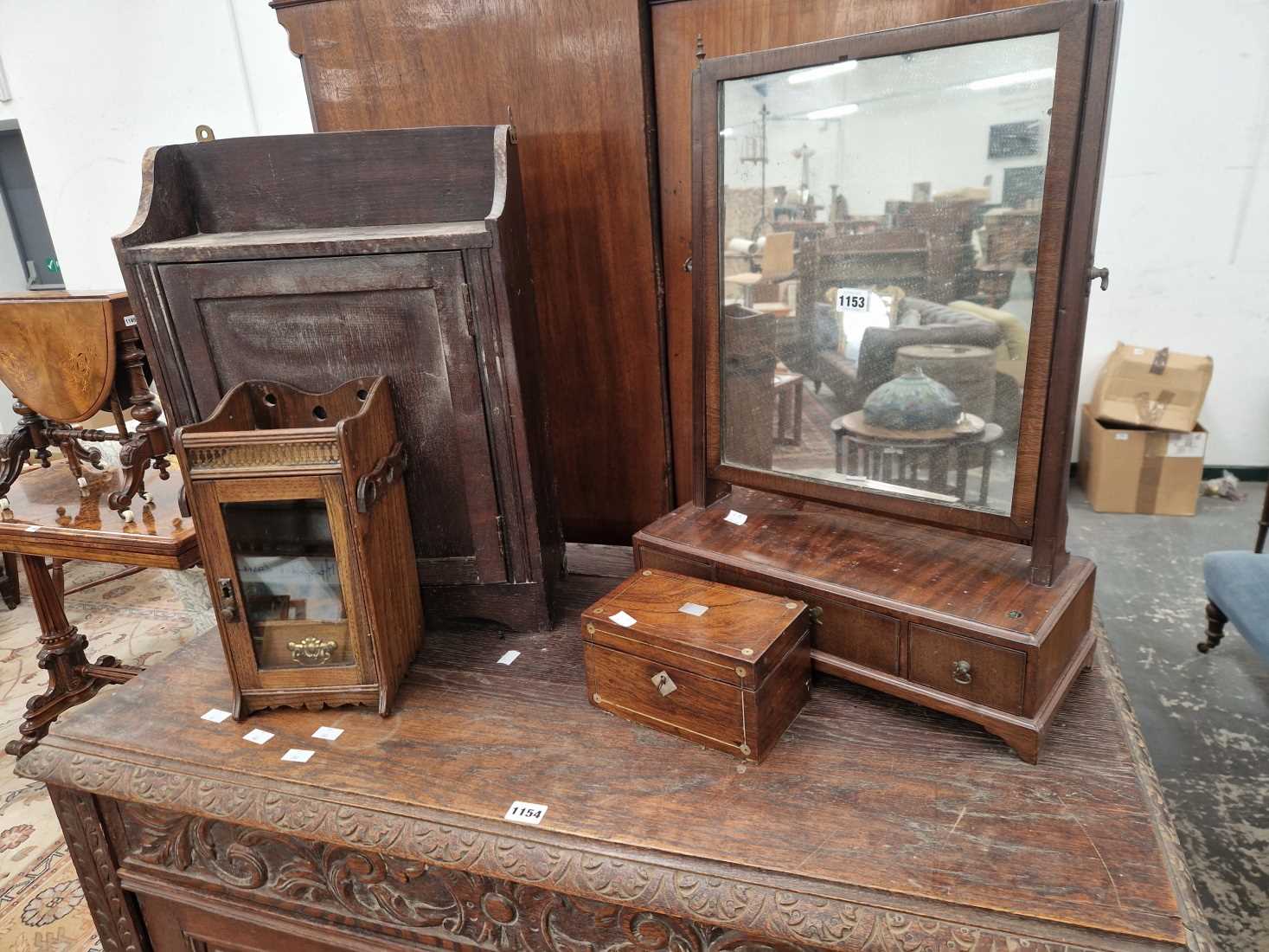 A Georgian swing mirror, a smokers cabinet, a tea caddy, and a rustic wall cabinet.