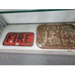 an iron sign inscribed fire and another inscribed F H 6 Ft