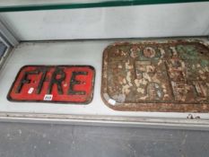an iron sign inscribed fire and another inscribed F H 6 Ft