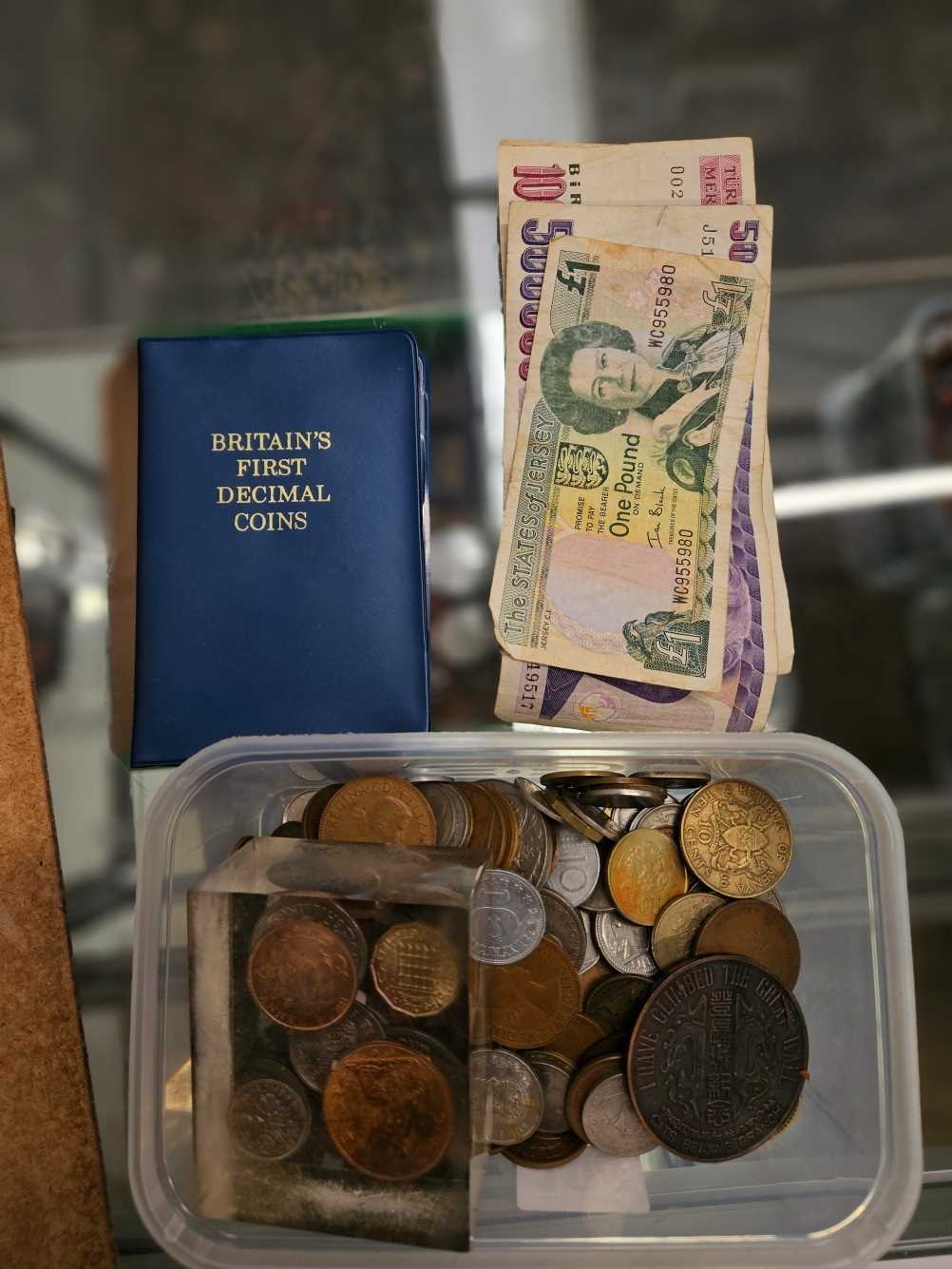 A collection of world coins and banknotes.