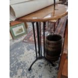 A tall iron based pub table.