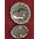 A Georgian silver hallmarked four footed silver tray, and a later hallmarked silver three footed