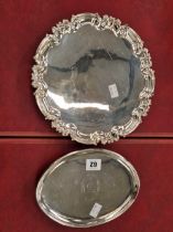 A Georgian silver hallmarked four footed silver tray, and a later hallmarked silver three footed