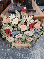 A painted tin floral screen.