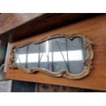 A gilt framed mirror. H 71cms Widest width 28cms narrowist width 20cms