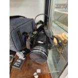 A cased Nikon Coolpix P 600 camera, two batteries, charging lead, etc.