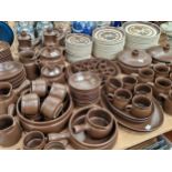 Langley stone ware plates decorated with three flower stems together with a brown glazed stone