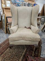 A Georgian style wingback armchair.