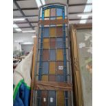 A pair of leaded stained glass panels. H 90cms W 27cms