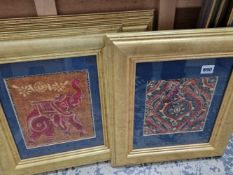 Four framed eastern textile samples.