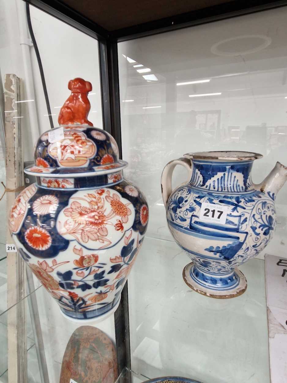 An 18th C. Imari jar and cover together with a blue and white faenza wet jug ewer