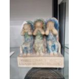 A Compton pottery plaster group of angels hear speak and see no evil