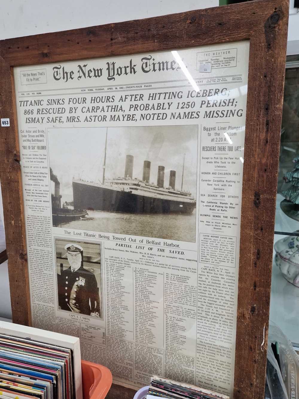 A framed Titanic poster.
