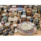 Chinese and Japanese vases, dishes and a figural lamp