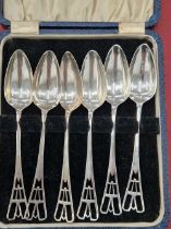 A set of six hallmarked silver grapefruit spoons in the Art Deco taste.