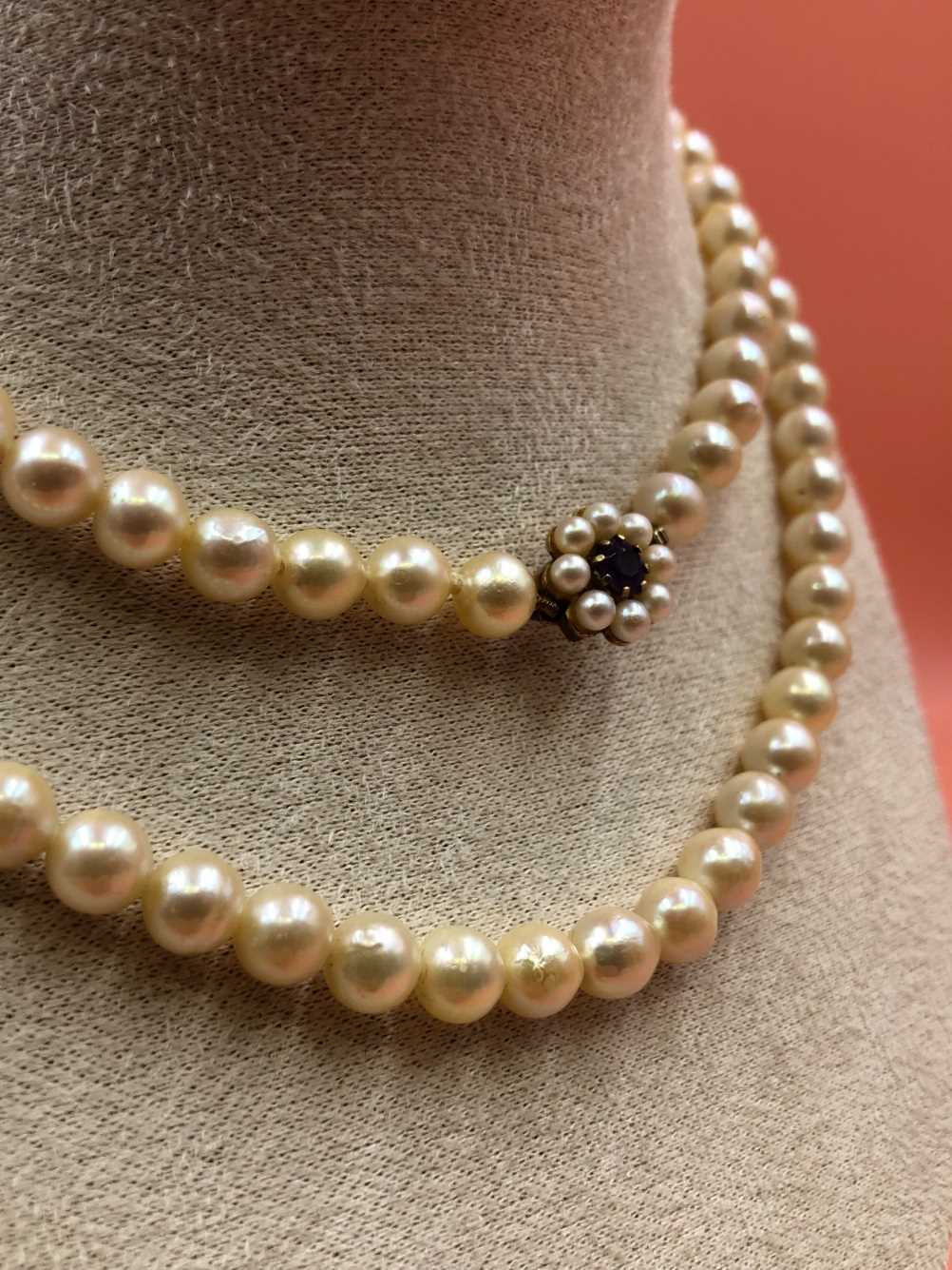 A opera length row of  slightly graduated cultured pearls complete with a 9ct gold stamped - Image 3 of 5