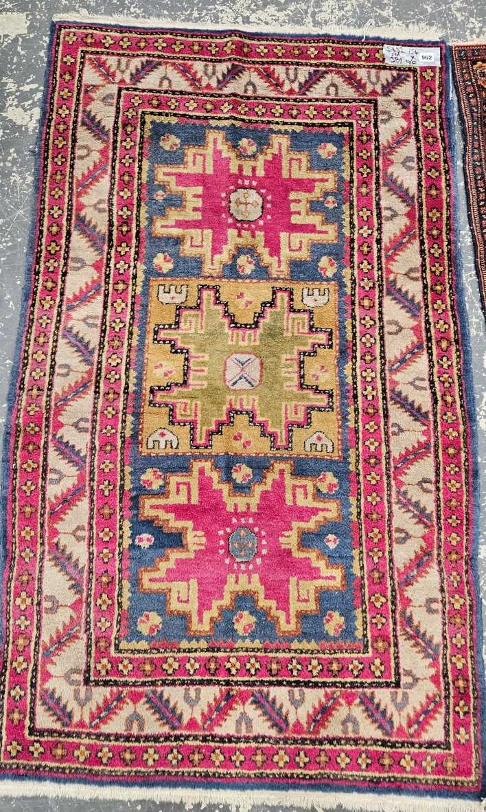 A TURKISH RUG OF CAUCASIAN DESIGN 154 x 90 cm.