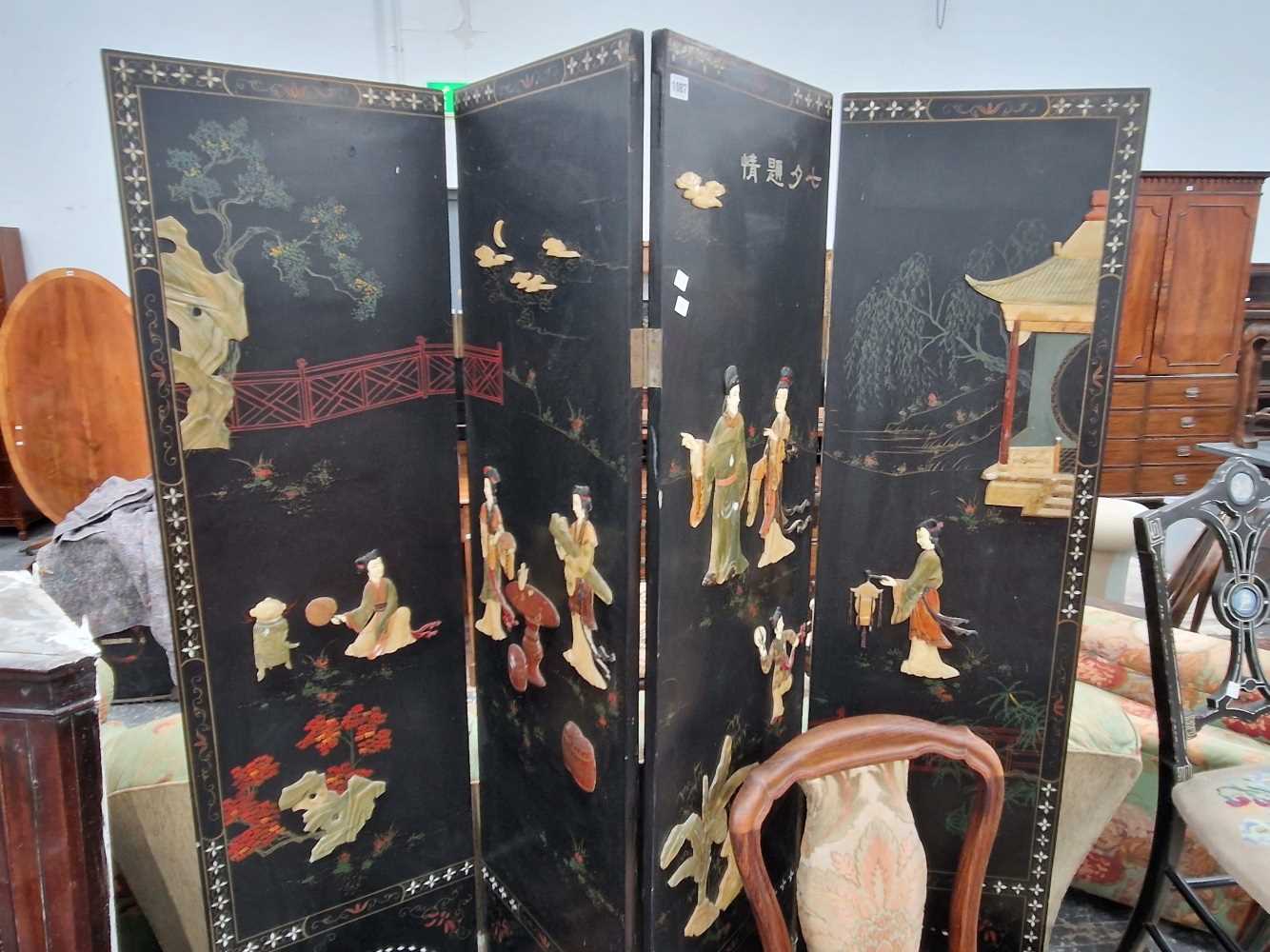 An Oriental lacquer and stone set screen. Thank you for your inquiry, details are as follows: