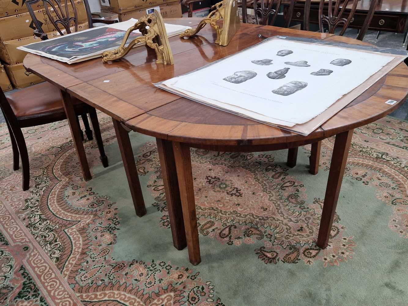 A Georgian mahogany cross banded D end dining table.