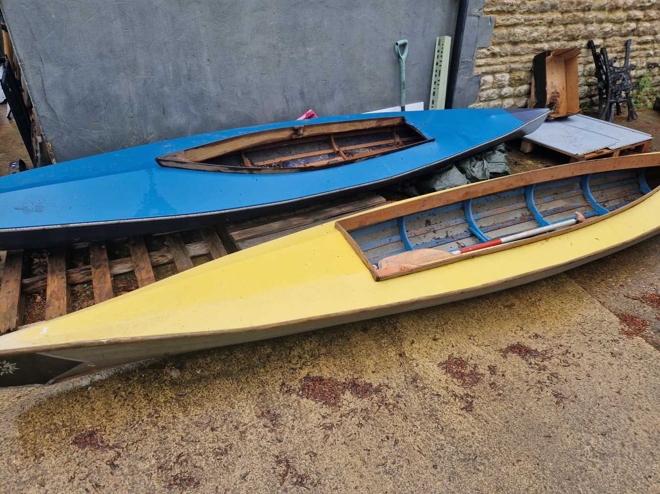 Two vintage wood Swellerton canoes