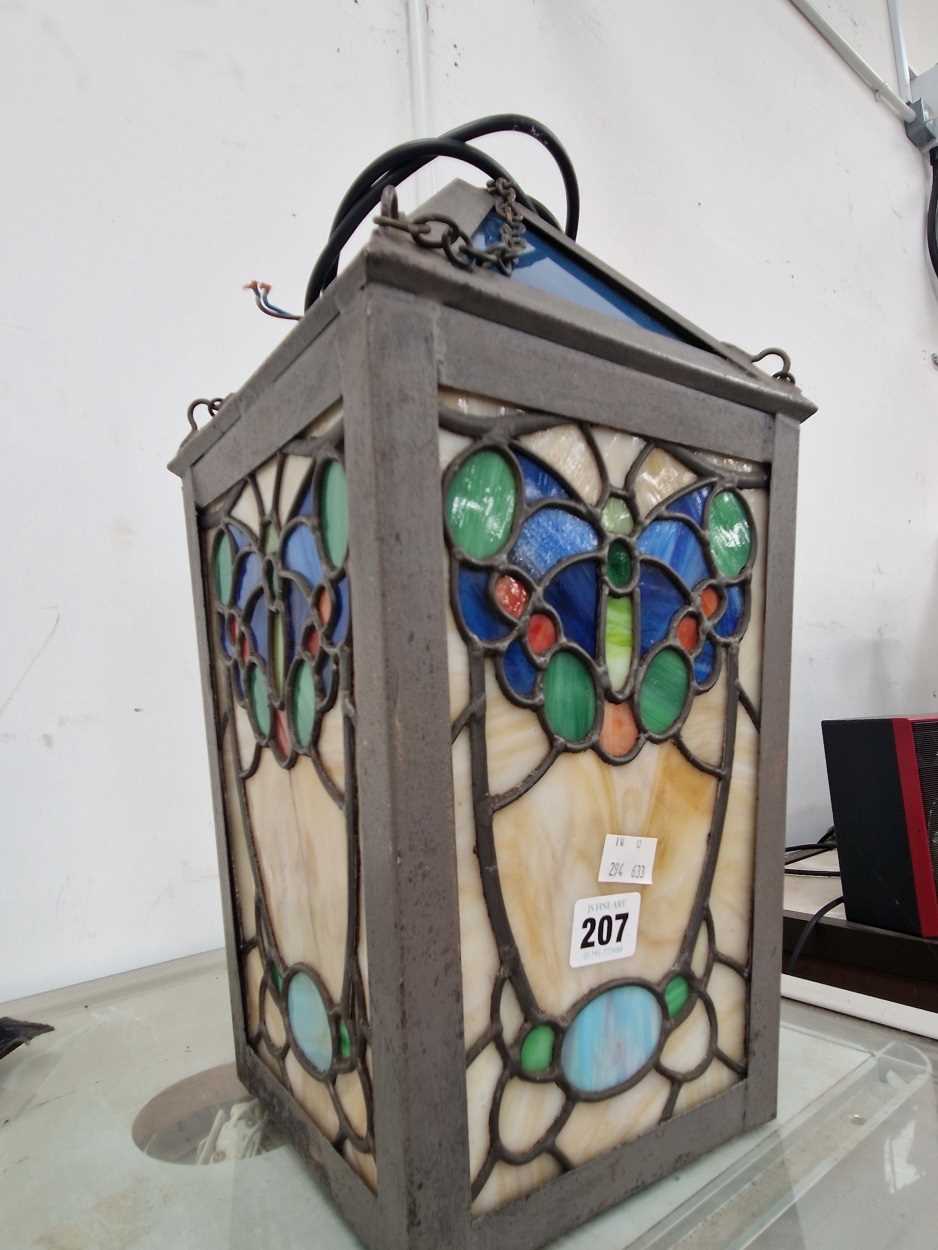 A lantern the leaded glass worked with butterflies There is a large pane cracked, which has been