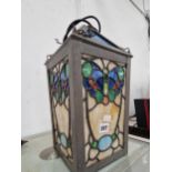 A lantern the leaded glass worked with butterflies There is a large pane cracked, which has been