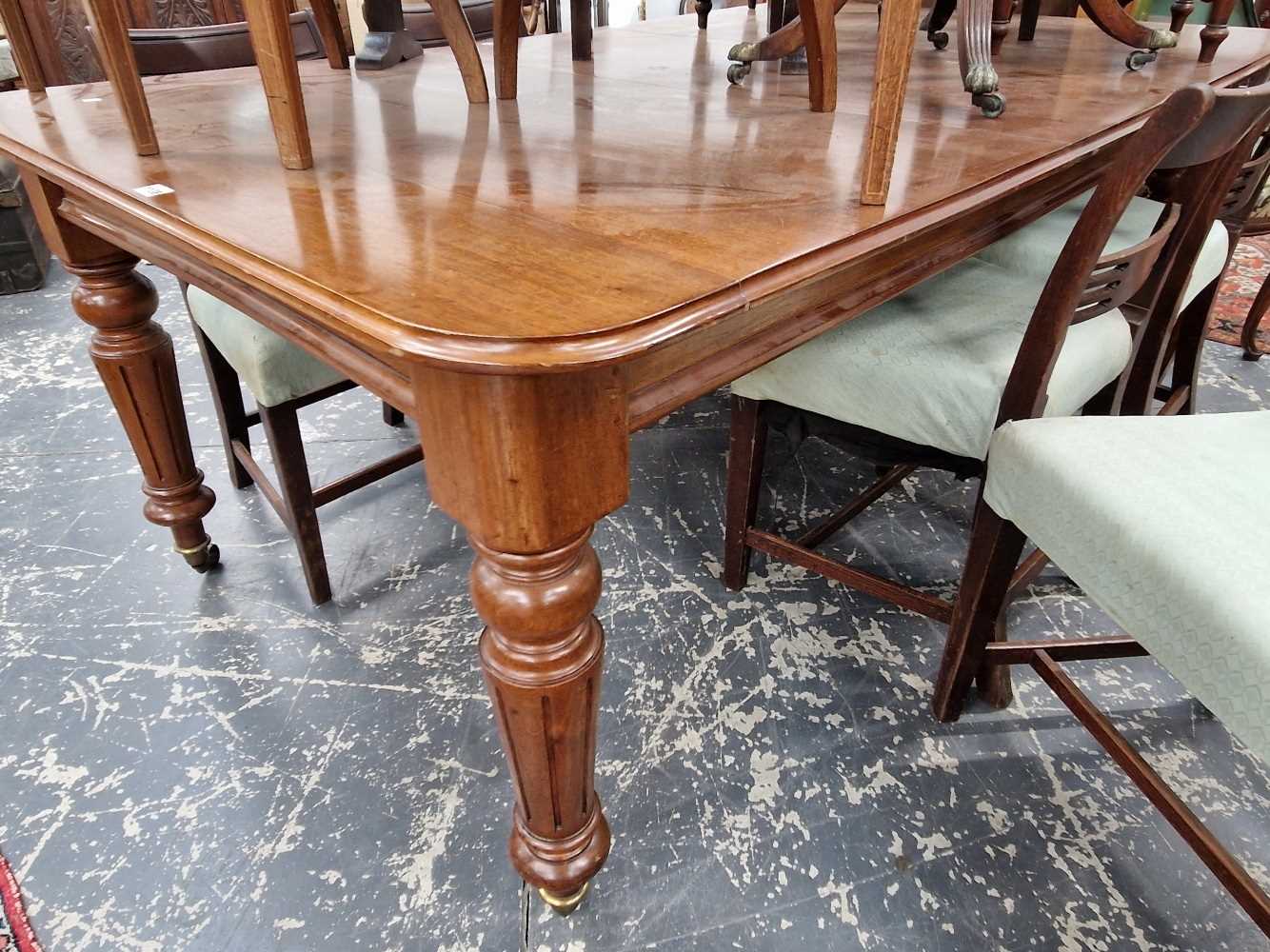 A Victorian mahogany dining table.
