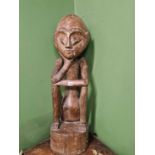 A large carved African figure, approximately 100cm tall. Height is approximately 100 cm tall.