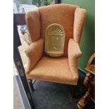 A vintage Georgian style wing back armchair.