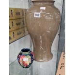 A Moorcroft grey baluster vase H 38cm together with a Moorcroft ovoid vase slip trailed with