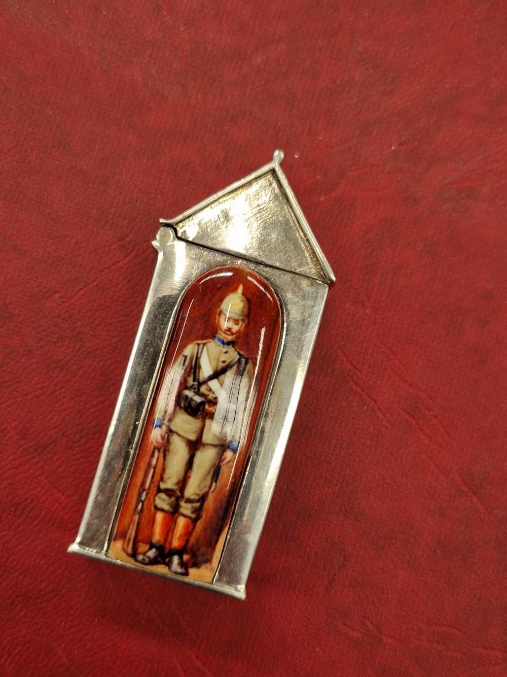 A sterling silver and enamelled sentry box vesta.