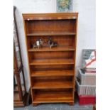 A yew wood open front bookcase.
