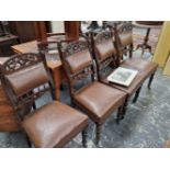 A set of four late Victorian dining chairs.