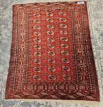 A GOOD QUALITY TEKKE BOKHARA RUG 170 x 139 cm.