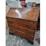 An 18th century walnut bureau.