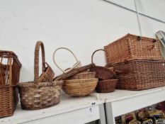 A collection of flower arranging baskets together with two picnic baskets