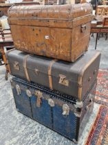 Three vintage cabin trunks.