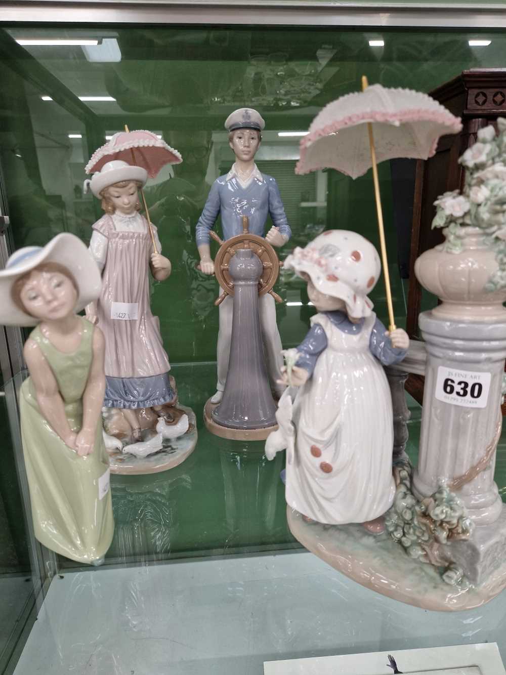 Four Lladro figurines. Good age commensurate condition