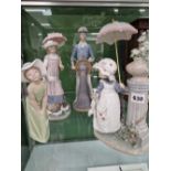 Four Lladro figurines. Good age commensurate condition