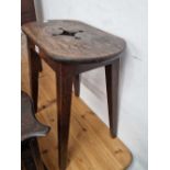 A rustic oak cottage stool.