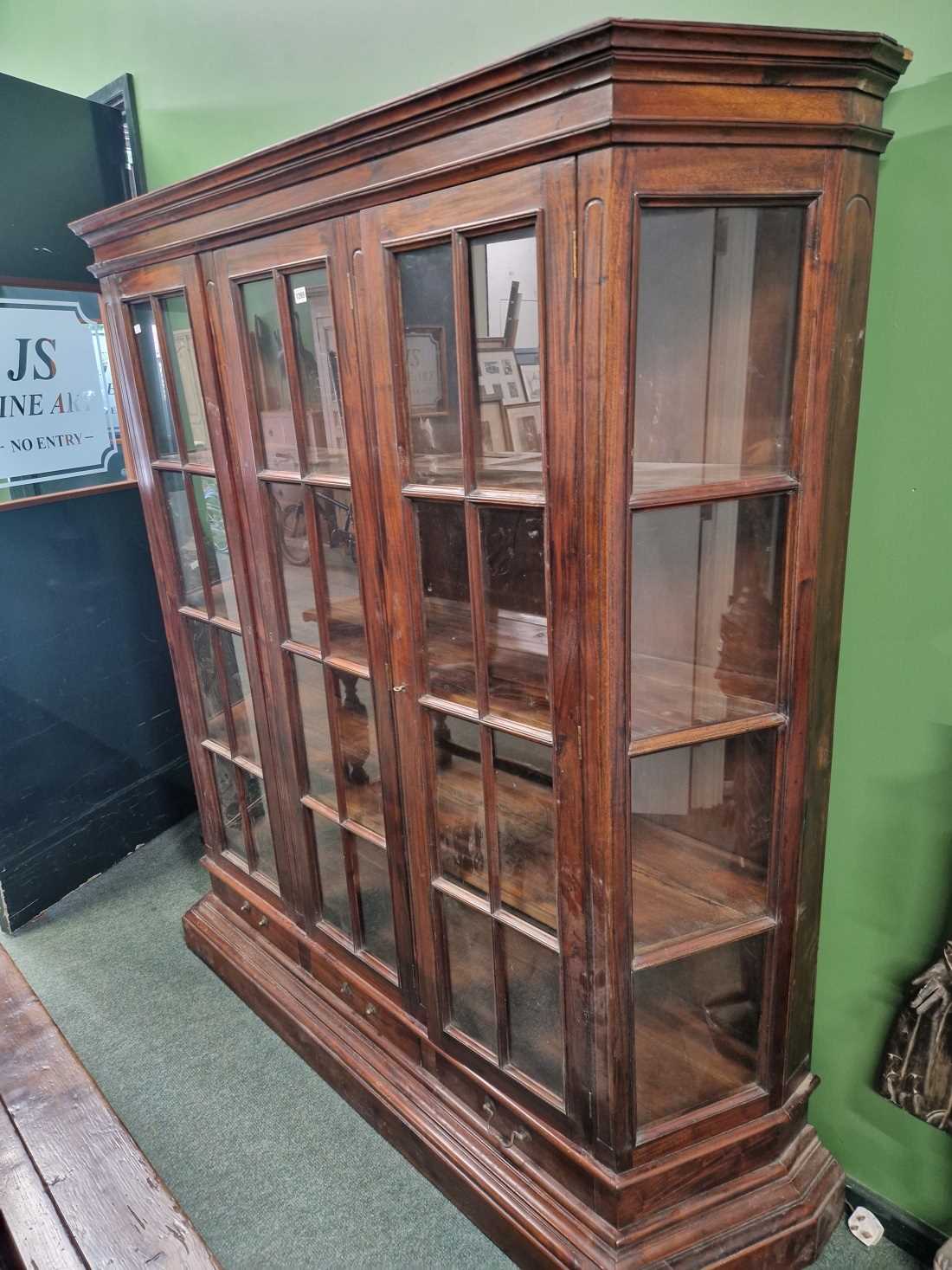 A large glazed display bookcase.