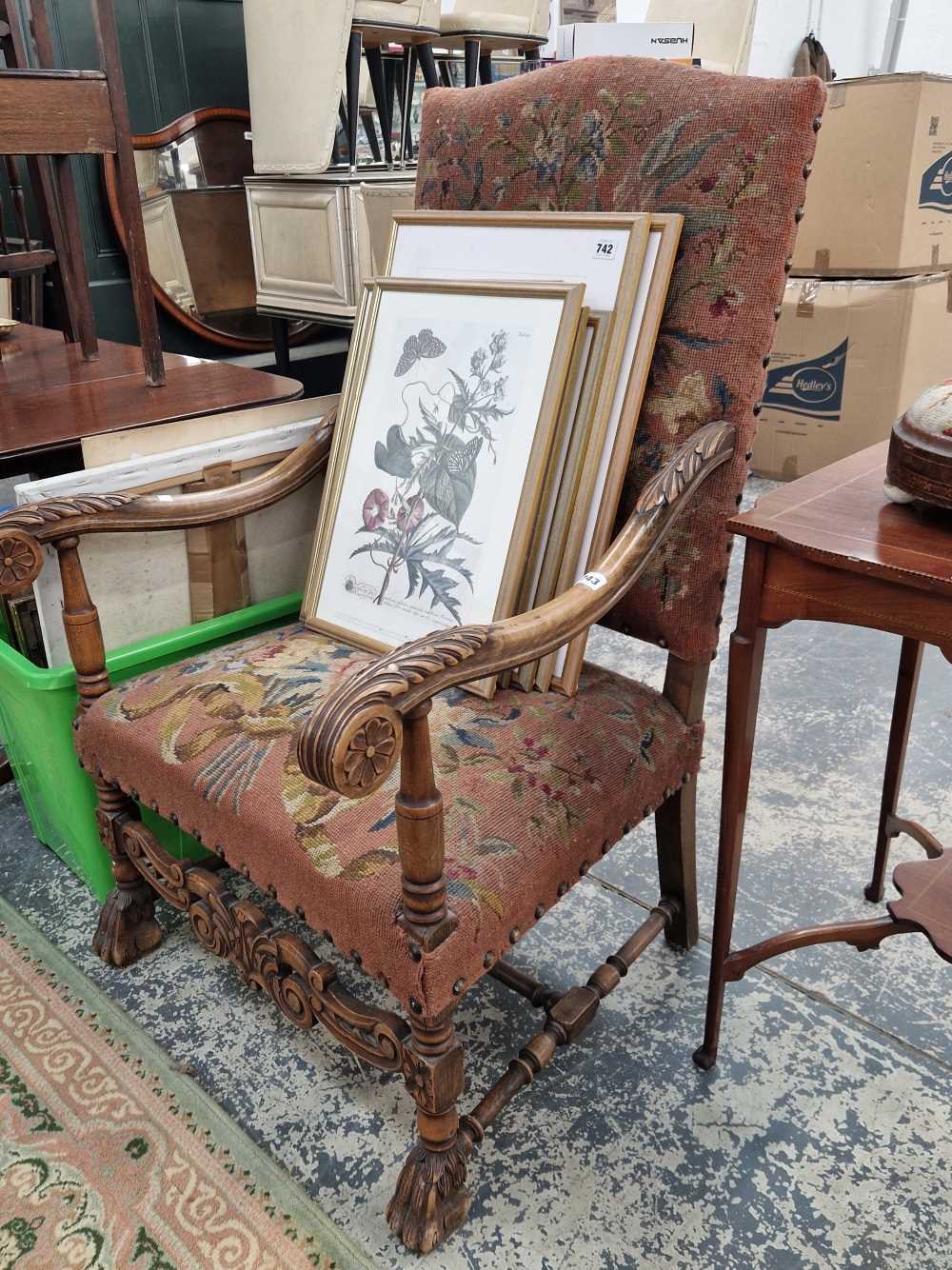 An antique walnut 17th century style high back armchair with tapestry type upholstery.