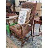 An antique walnut 17th century style high back armchair with tapestry type upholstery.