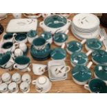 A collection of Denby dinner wares decorated in green and with wheat sprigs