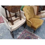 A Victorian nursing chair and a leather upholstered chair.