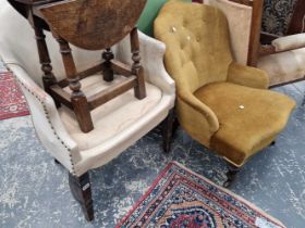 A Victorian nursing chair and a leather upholstered chair.