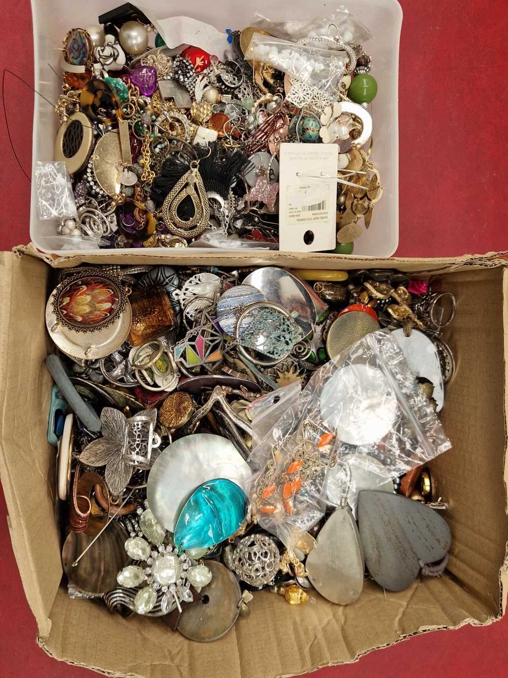 A collection of pendants, earrings, and other costume jewellery.