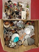 A collection of pendants, earrings, and other costume jewellery.