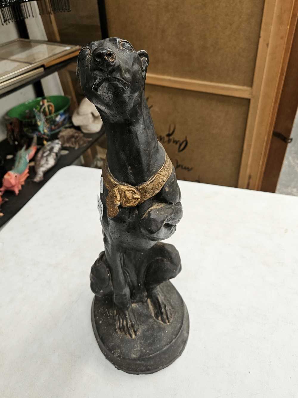 An iron bootscraper together with a plaster seated greyhound figure Chip to base of greyhound - Image 9 of 17