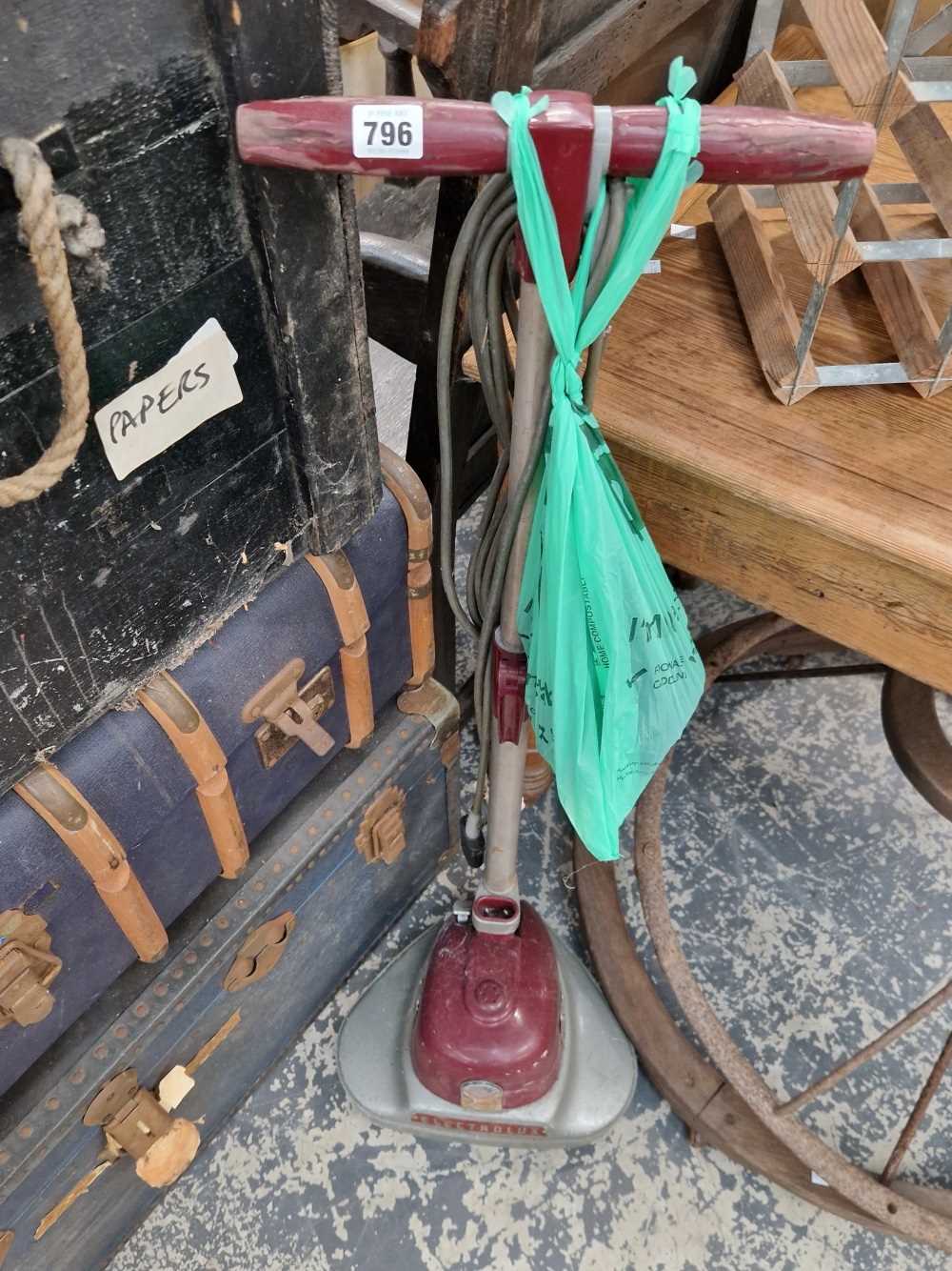 A vintage Kirby floor polisher.